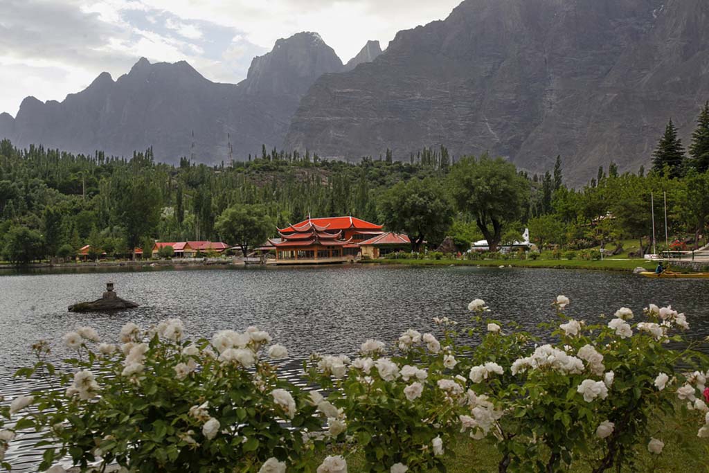 Shangrila Resort Skardu Tour with red roof building and mountain lake