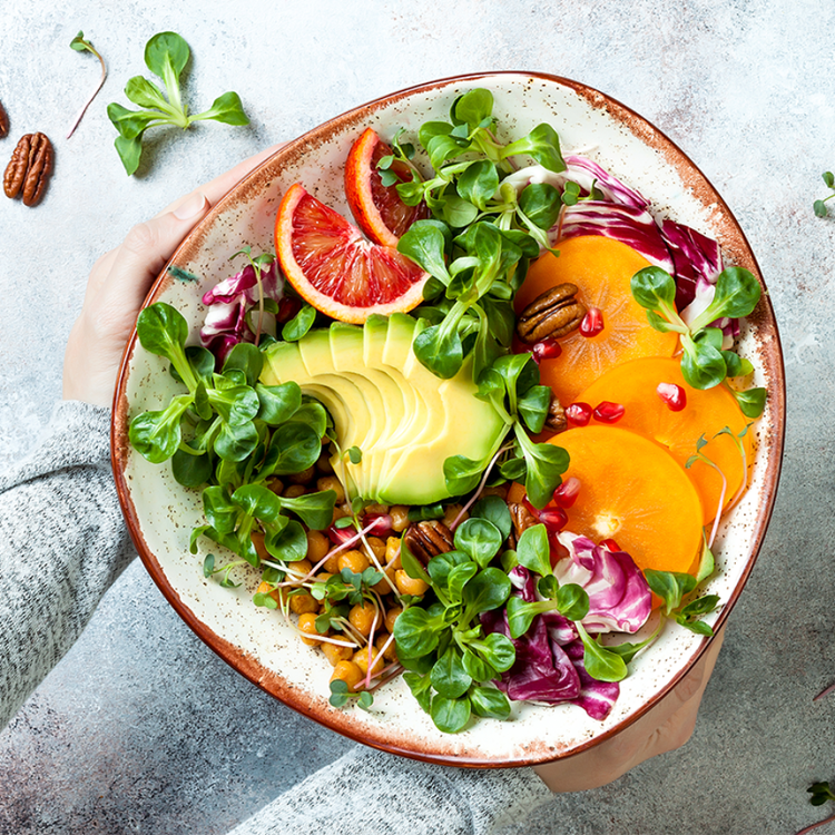 Colorful plant-based nutrition bowl with fresh vegetables and greens representing 2026 healthy eating trends
