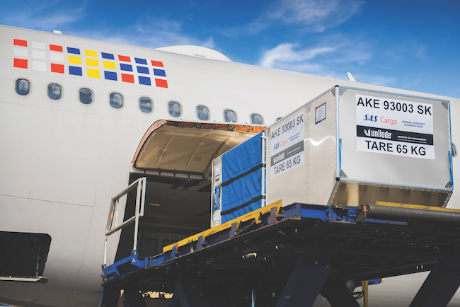 Air cargo loading pharmaceutical containers onto aircraft