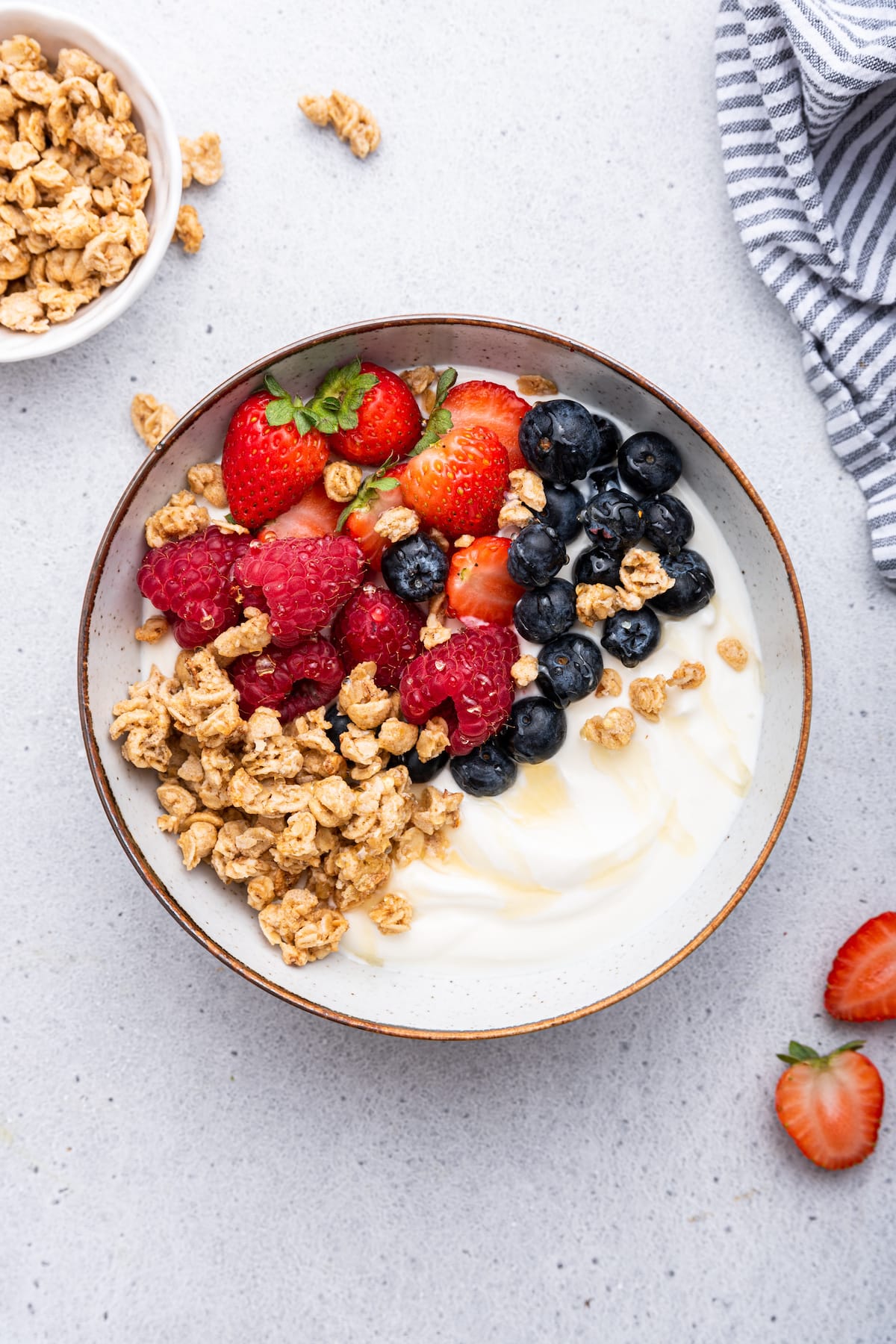 Gut Friendly Breakfast Bowl with Probiotics Healthy yogurt bowl with fresh berries and granola overhead breakfast view