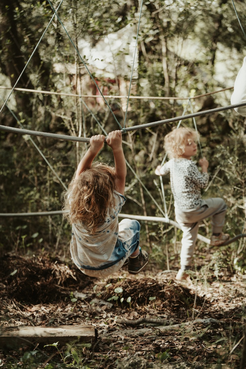 Children climbing in nature