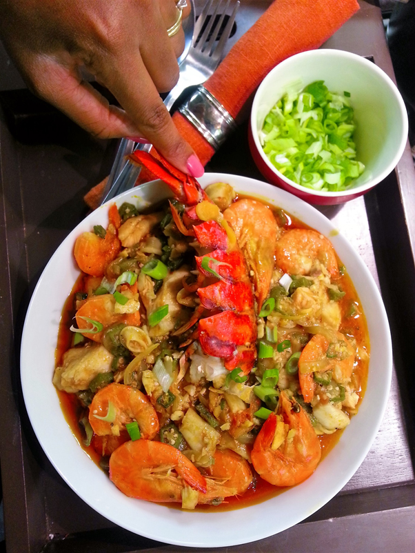 Seafood okra made with fresh okra, prawns, crab, catfish, periwinkle, red palm oil, crayfish, scotch bonnet and uziza leaves - RoyalRoom Restaurant Lagos