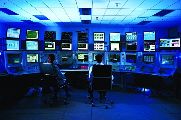 Chemical plant control room with monitoring systems