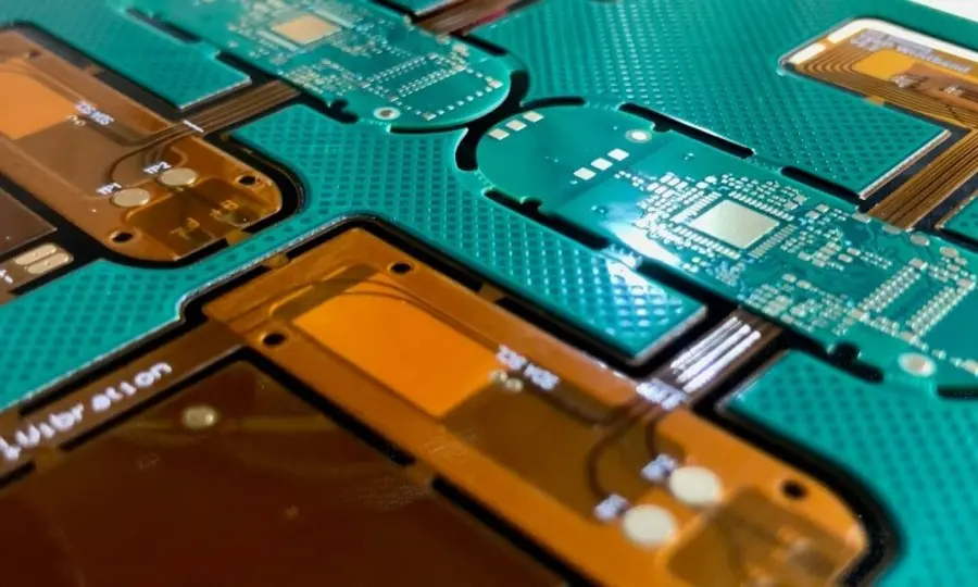 Rigid-flex PCB automotive electronic control module design showing rigid sections connected by flexible circuits for 3D configuration in engine compartment ECMs