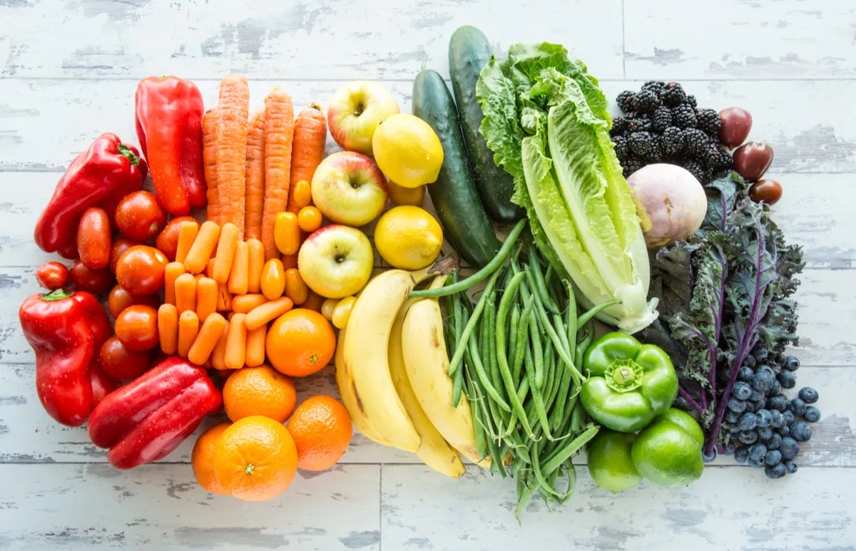 Colorful fruits and vegetables arranged by color showing nutritional variety