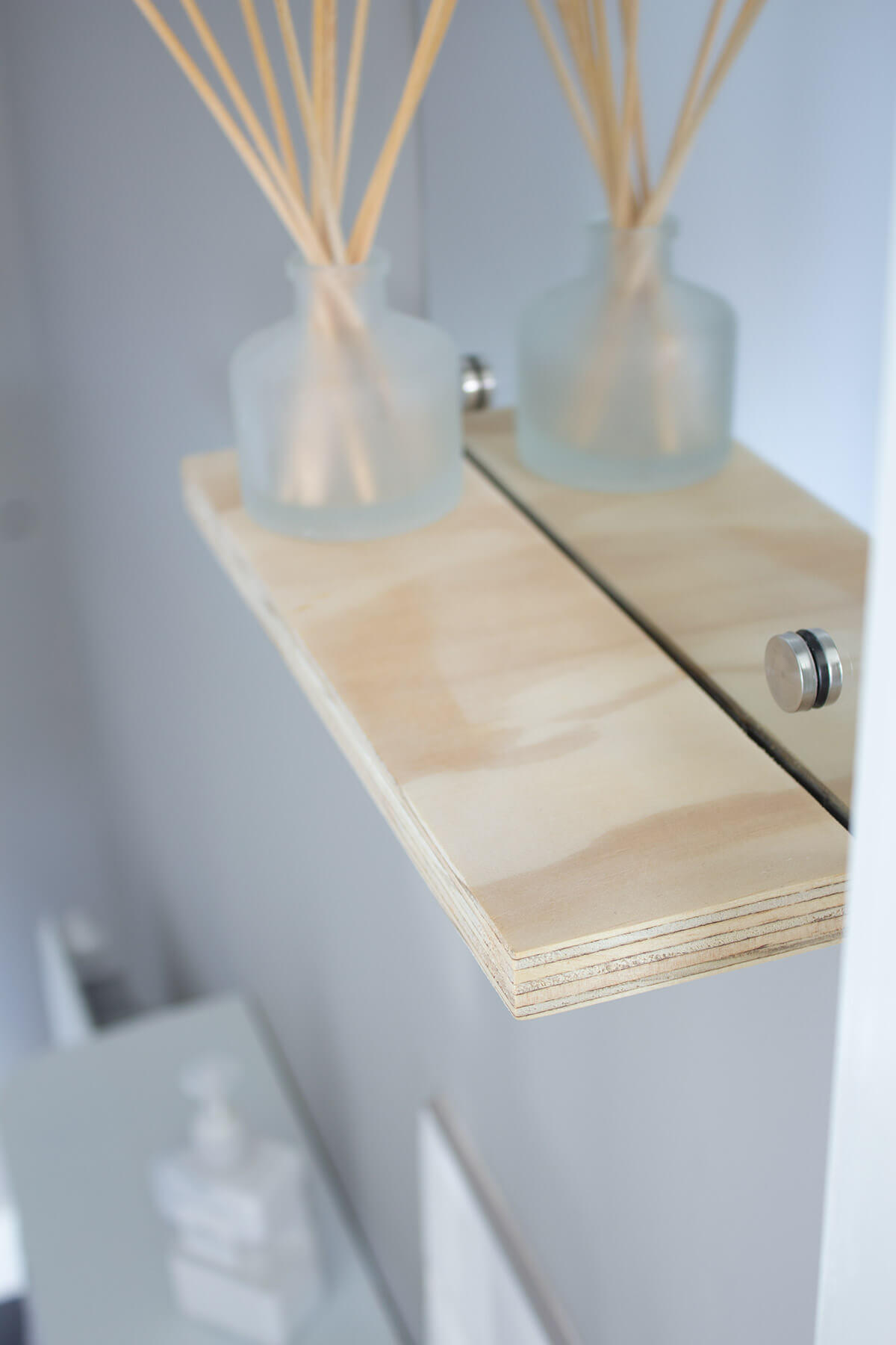 Floating shelf with mirror installation