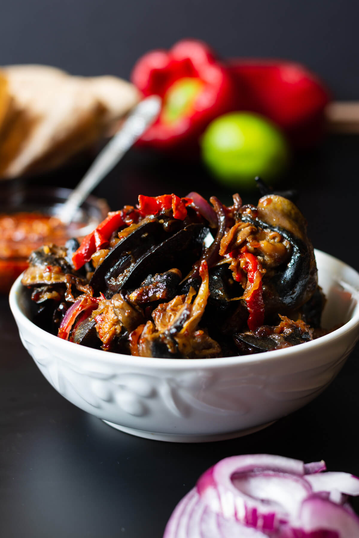 Peppered snail made with giant African snail, scotch bonnet, tatashe, onions, garlic, curry and seasoning cubes - RoyalRoom Restaurant Lagos