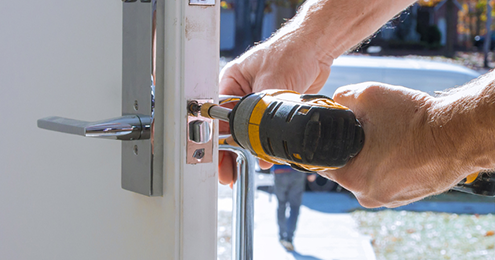 Door lock repair with power drill