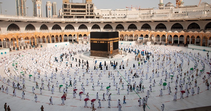 Umrah pilgrims performing Tawaf around Kaaba